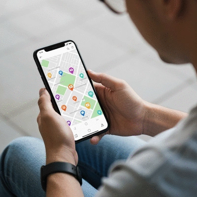 Person using a smartphone with a map showing local businesses, overlaid with local SEO icons, no text, no words, no typography, 8K